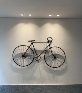 a bike hanging on a wall in a room at IN CENTRO TORINO Charme Appartaments in Turin