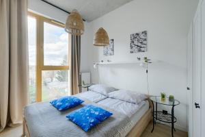 Posteľ alebo postele v izbe v ubytovaní Apartamenty Patriotów 303
