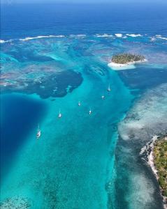 an aerial view of a group of boats in the ocean at Splendid San Blas - All Inclusive in Playón Chico