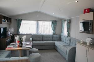 A seating area at 51 Lytchett Bay View, 3 bed, Rockley Park Poole