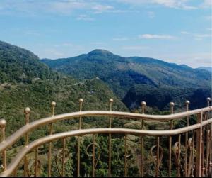 a view of the mountains from the top of a hill at Hotel El Mirador in Xilitla