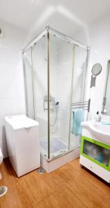 a bathroom with a shower and a sink at Blue Home Monte Gordo in Monte Gordo +6 photos