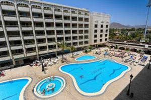 an overhead view of a large building with two pools at Kn Aparthotel Columbus in Playa de las Americas