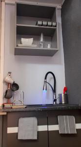 a kitchen with a sink and a counter top at Luxury Comfort 1 bedroom Suite in Birmingham