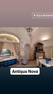 Ένα ή περισσότερα κρεβάτια σε δωμάτιο στο Antiqua Nova