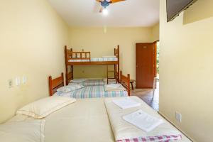 Postel nebo postele na pokoji v ubytování Pousada do Marquinhos