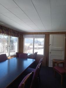 a conference room with a table and chairs at Cramers Point Lake Breeze in Lake George
