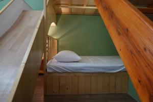 Postel nebo postele na pokoji v ubytování Provence Homestay