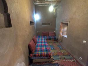 Katil atau katil-katil dalam bilik di Authentic riad & activities Erg