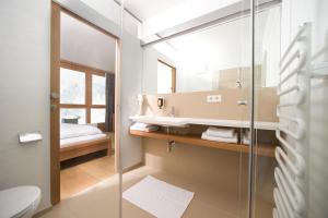 Koupelna v ubytování Hotel Manggei Designhotel Obertauern