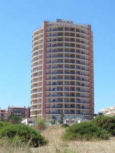 a tall building with a sign on the side of it at Praia Mar in Portimão