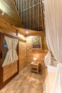 Ein Bett oder Betten in einem Zimmer der Unterkunft Bamboo Bungalows