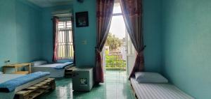 Giường trong phòng chung tại Mai Homestay