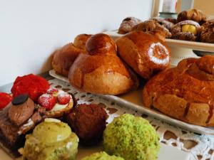 a bunch of pastries on plates on a table at Fera O' Luni in Catania
