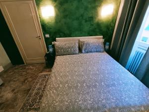Katil atau katil-katil dalam bilik di Appartamento Aurora