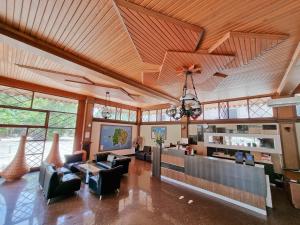a large living room with a wooden ceiling at Green Tropical Village in Tanjungpandan