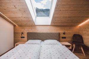 Säng eller sängar i ett rum på Mudlerhof