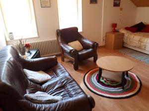 A seating area at Halte au pied du Creux du Van
