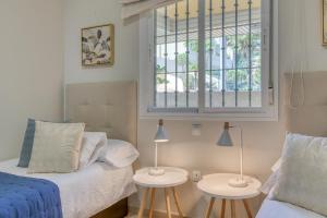 A bed or beds in a room at Hanami Puerto Alto PA 1-5 Még 25 kép