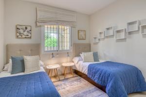 A bed or beds in a room at Hanami Puerto Alto PA 1-5