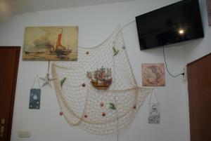 TV a/nebo společenská místnost v ubytování Rooms Tia