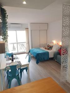A bed or beds in a room at La Bonita - Benalmadena