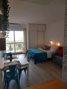 A bed or beds in a room at La Bonita - Benalmadena