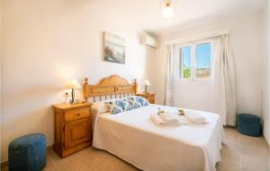Posteľ alebo postele v izbe v ubytovaní Gorgeous Home In Port Dalcúdia + 10 fotografií