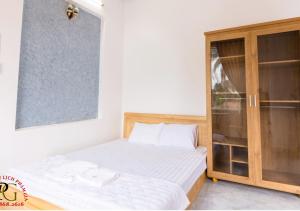 Giường trong phòng chung tại NHÀ NGHỈ & HOMESTAY PHẠM GIA