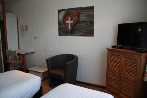 TV a/nebo společenská místnost v ubytování Hotel Halleux