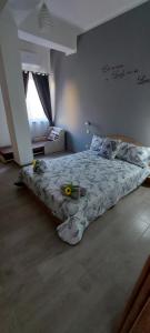 a bedroom with a bed with flowers on it at Clausis in Parghelia
