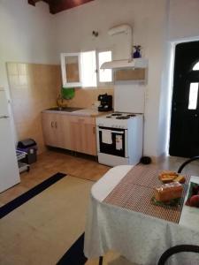 A kitchen or kitchenette at Traditional House with Loft -Michalis' House in Kouramades-