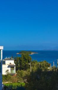 a view of the ocean from a building at Four Seasons Apartments in Ksamil