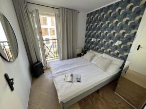 Postel nebo postele na pokoji v ubytování Apartament Przy Plaży PROMENADA Świnoujście