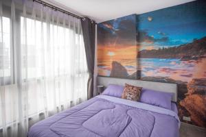 a bedroom with a dog pillow on a bed at The Base Central apartments in Pattaya Central +64 photos