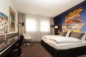 Postel nebo postele na pokoji v ubytování Best Western Hotel Nürnberg am Hauptbahnhof