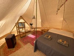 Posteľ alebo postele v izbe v ubytovaní Paraiso Bell Tent