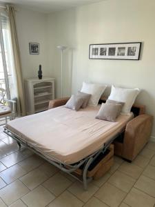 Postel nebo postele na pokoji v ubytování Cannes, la Croisette, Palais Miramar
