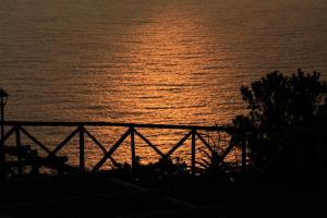 a view of the ocean at sunset at Hotel Quinta Do Furao in Santana
