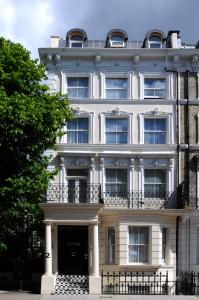 a large white building with a lot of windows at Knaresborough Boutique Apartments in London