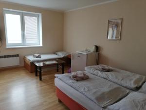 Posteľ alebo postele v izbe v ubytovaní Penzión Novstav Turčianske Teplice
