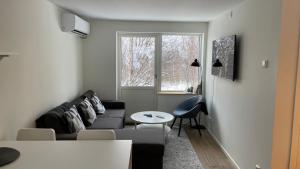 Ruang duduk di Åreskutans lägenhet med laddning för bil 22kW