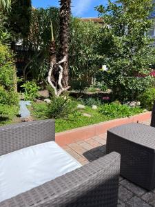 a table and two chairs sitting on a patio at Villa Corallo in Grado +13 photos