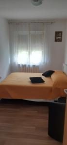 a large bed in a room with a window at SAN MARKO 2 in Lovran