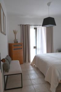 Postel nebo postele na pokoji v ubytování ML Carvoeiro Mar Apartment
