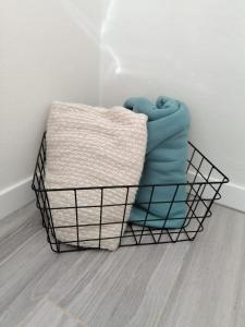 a basket with a blanket in the corner of a room at Casa da Villa in Vila do Bispo +25 photos