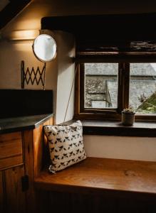 a room with a window and a pillow on a counter at Holwell Holistic Retreat in Barnstaple