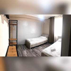Postel nebo postele na pokoji v ubytování Ave hotel