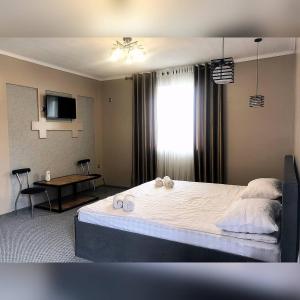 Postel nebo postele na pokoji v ubytování Ave hotel