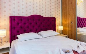 A bed or beds in a room at Sweet Homes 6 Még 7 kép